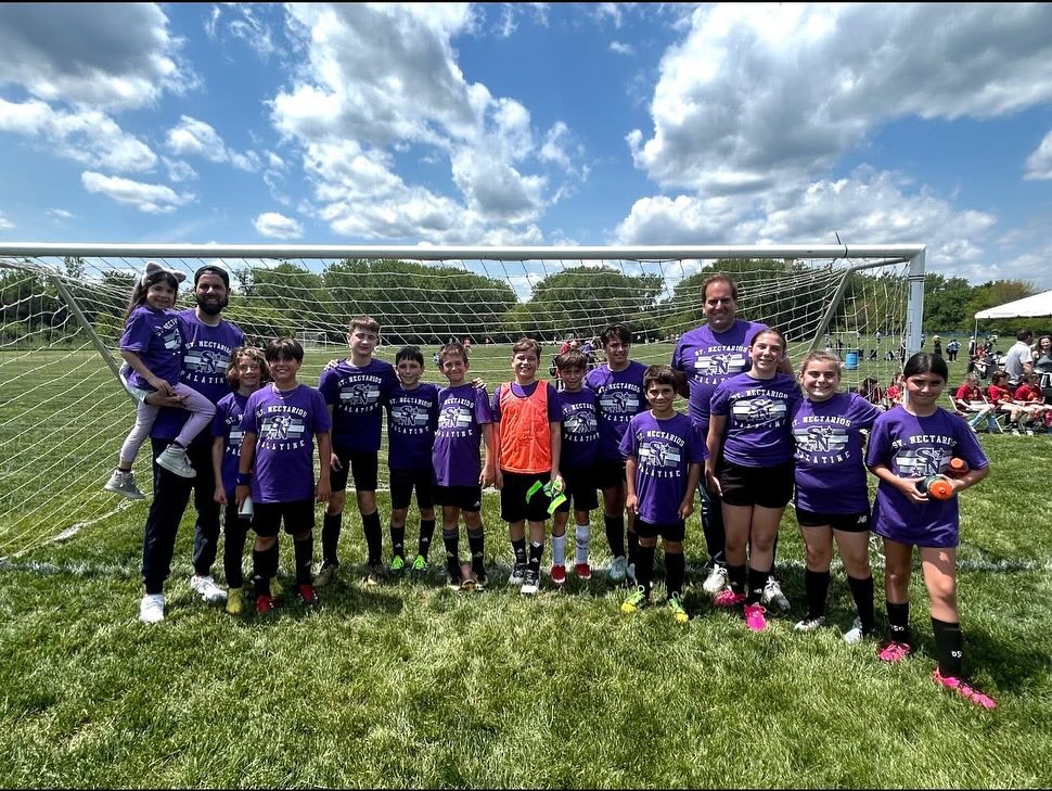 St. Nectarios youth team in purple shirts at the Junior Olympics