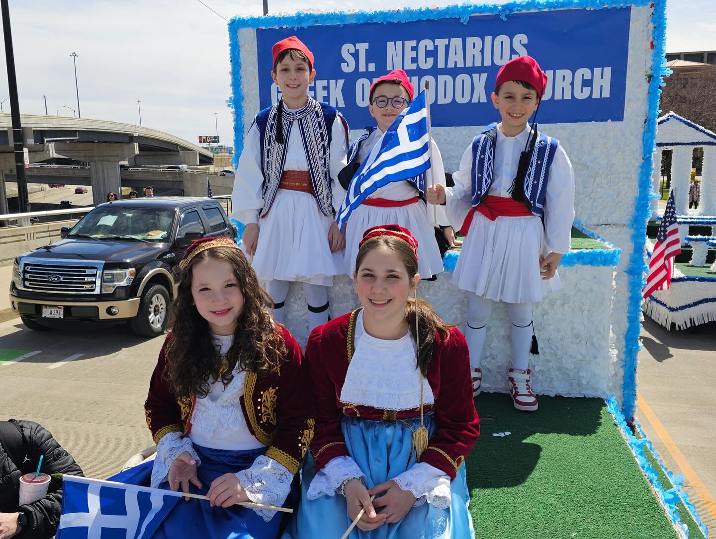Greek School students in traditional costume on the parish float