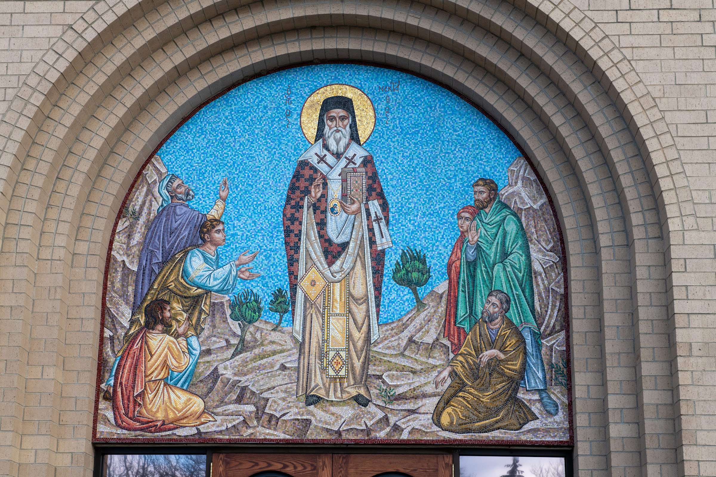 The church doors beneath the mosaic of Saint Nectarios