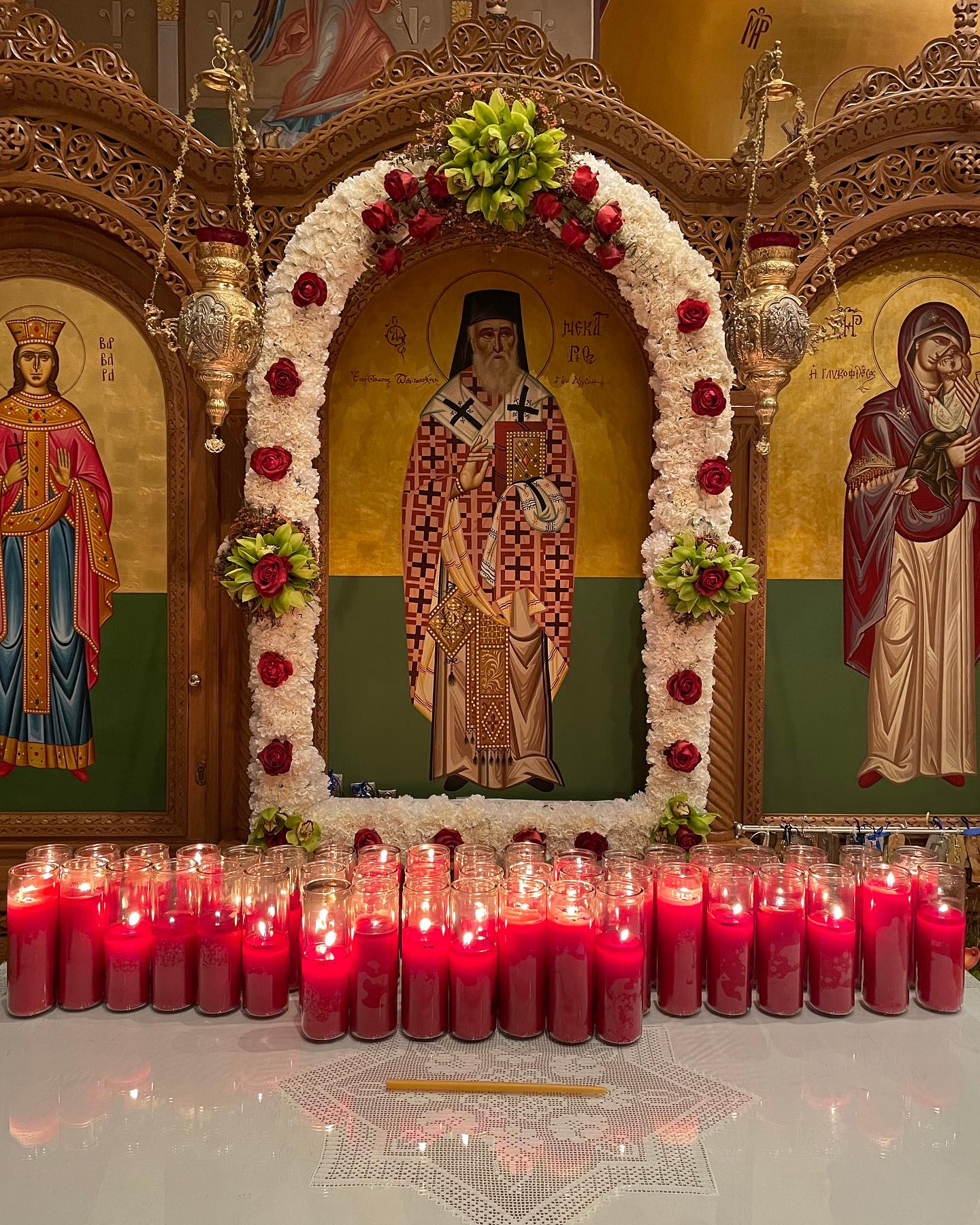 St-Nec-Web-StNec-Feast-A Icon of St. Nectarios on a shrine with candles for his feast day